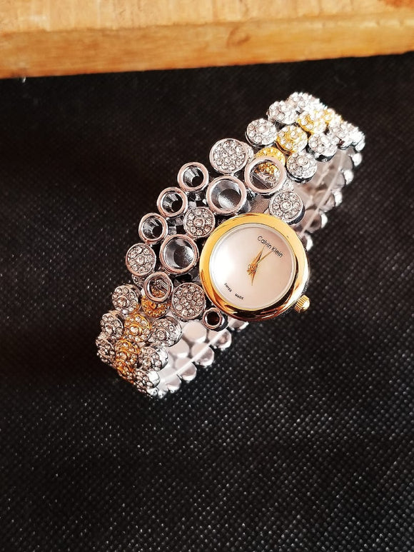 LADIES ORNAMENTAL WATCH IN GOLD AND SILVER TONE