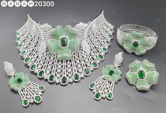 Divyanshi ,Platinum Finish  Green stone studded Bridal Heavy Diamond Necklace set with Bracelet and Ring Combo -DWARAKA001GS