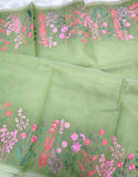 Elegant pista green moonga Kota saree featuring delicate floral embroidery along the borders in soft pink and green hues-DIYA001MC