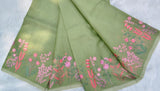 Elegant pista green moonga Kota saree featuring delicate floral embroidery along the borders in soft pink and green hues-DIYA001MC