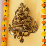 Lord Ganesha in Brass with Intricate carvings and a Oil lamp -HRH001GOL