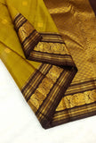Shobika , Vintage   Kanchipuram traditional Borders with Mayil  Butties Chocolate and Gold Combination Saree  -PDS001KS