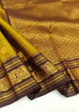 Shobika , Vintage   Kanchipuram traditional Borders with Mayil  Butties Chocolate and Gold Combination Saree  -PDS001KS