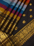 Rainbow Beauty ,  Kanchipuram silk saree with a striking plain black base, elevated by  rainbow weaving body-SACHI001RB