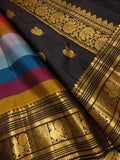 Rainbow Beauty ,  Kanchipuram silk saree with a striking plain black base, elevated by  rainbow weaving body-SACHI001RB