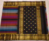 Rainbow Beauty ,  Kanchipuram silk saree with a striking plain black base, elevated by  rainbow weaving body-SACHI001RB