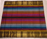 Rainbow Beauty ,  Kanchipuram silk saree with a striking plain black base, elevated by  rainbow weaving body-SACHI001RB