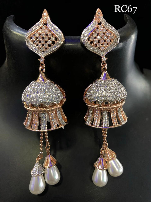 rose gold finish american diamond studded earring with a stone studdedjumka and a pair or whitepearl droplets hanging .