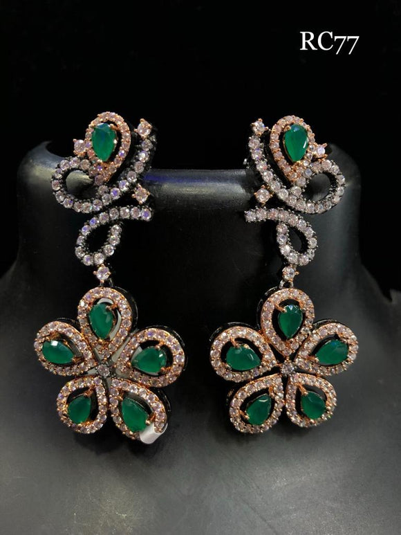 golden mango stud with diamond and jade flowers with a small stone jumka