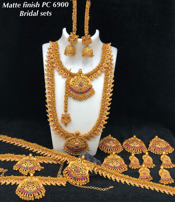 Complete bridal wedding jewellery set in traditional south Indian Mango designs with Ruby stones embedded