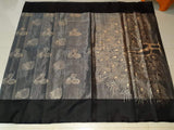Uppada silver tissue silk saree with black borders and Golden peacock print in pallu.
