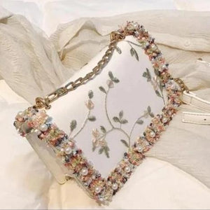 Cream Stylish Clutches With Beautiful Stone embellishments and embroidery work.