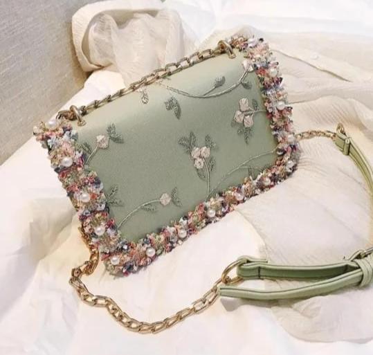 Green Stylish Clutches With Beautiful Stone embellishments and embroidery work.