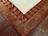 White Saree with Red Lace Borders.