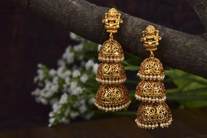 Hand craftedthree layered Lakshmi   Gold jumka with pearls for women.