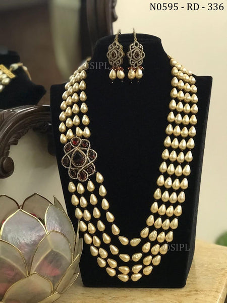 three strand pearl necklace with brooch