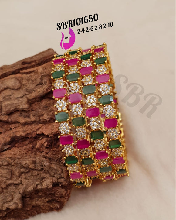 NAKSHATRA , SET OF 4  GOLD PLATED BANGLES WITH GREEN,PINK AND WHITE  STONES-SAYDS16001N