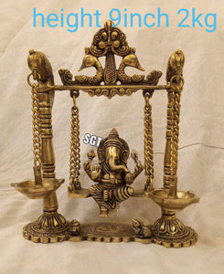 VIGNESWARA , SITTING ON SWING WITH LAMPS HANGING ON BOTH SIDES  -BEST001SG