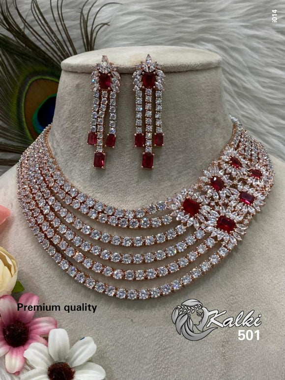 KALKI , ROSE GOLD FINISH DESIGNER NECKLACE WITH RUBY STONES SIDE BROOCH AND MATCHING EARRINGS -MOE01KL
