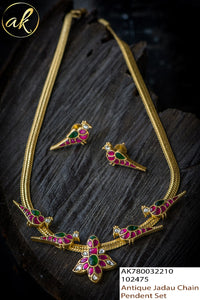 AMBIKA, ANTIQUE FINISH JADAU PARROT DESIGN PENDANT SET WITH GREEN ,PINK AND WHITE STONES -LRPSBL001M