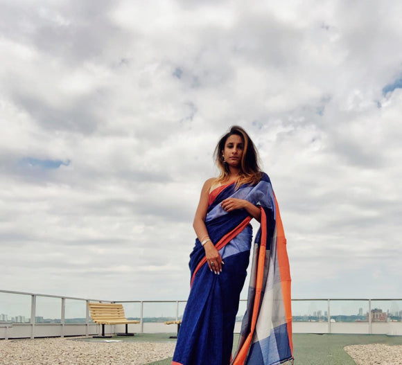 Blue Linen Saree with orange and Silver Border