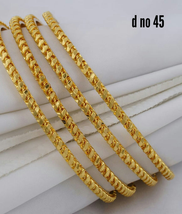 Golden twisted bangles