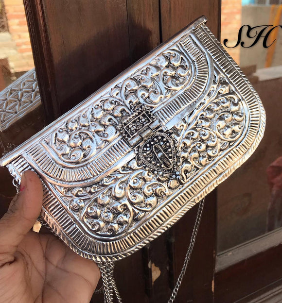 Aurat jewellery & clothing - German silver Handmade Purse Handcrafted  clutches Price=1400rs. Free shipping. Dm for buy. Dimension=18*14*4.5cm  approx Material=German silver Handcrafted Good quality | Facebook