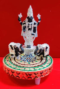 Silver Idol with elephants on a beautiful meenakari stand