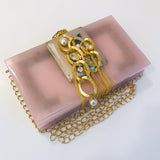 Lizzie beautiful Resin clutch  Bag for women Pink Color, with hand made Brooch With Tassels