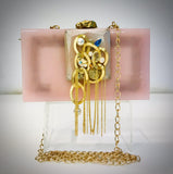 Lizzie beautiful Resin clutch  Bag for women Pink Color, with hand made Brooch With Tassels